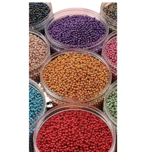 Assorted metallic glass seed beads for DIY jewelry making in clear containers.