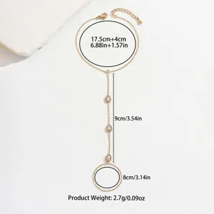 Pulsera de dedo minimalista en oro con circonitas de gota de agua y medidas.
