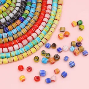 Detailed macro shot of 8mm colorful millefiori pumpkin glass beads for DIY jewelry