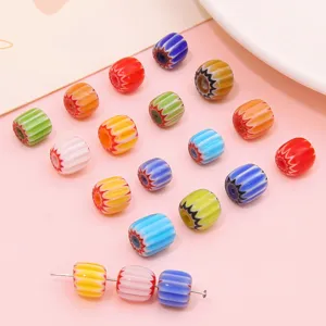 Close-up view of 8mm colorful striped millefiori glass barrel beads for DIY jewelry