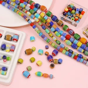 Close-up macro view of vibrant striped Millefiori glass beads for DIY jewelry making