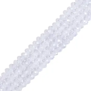 Close-up macro view of faceted clear synthetic crystal round beads for DIY jewelry making