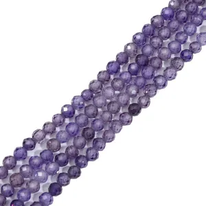 Detail shot of faceted purple synthetic zircon round beads for DIY jewelry making crafts