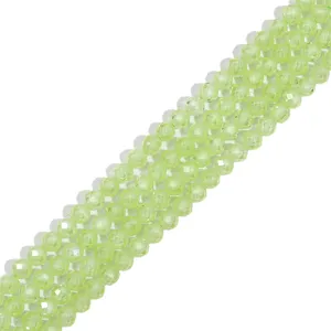 Detailed view of faceted light green zircon crystal beads for DIY jewelry making materials