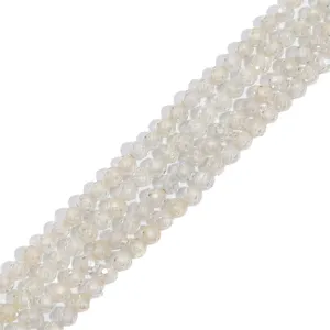 Close-up view of faceted round synthetic zircon beads for DIY jewelry making crafts.