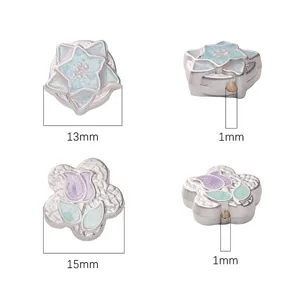 Macro view of alloy spacer beads with star and flower designs and dimensions
