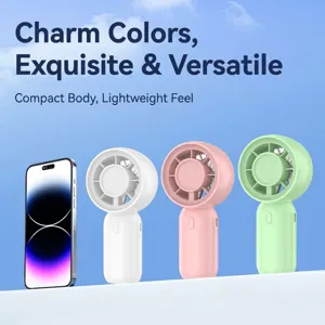 Set of portable mini handheld fans in pastel colors compared with a smartphone