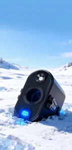 Close-up of portable waist fan with LED power display on icy background