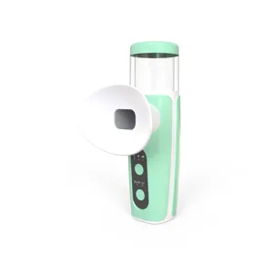 Detail shot of a mint green steam eye nebulizer with eye cup and power button