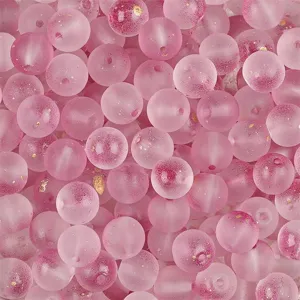 Macro view of pink frosted glass beads with gold glitter and bubble texture details.