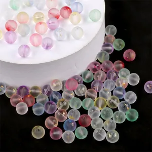 Detail view of colorful semi-transparent jelly bubble glass beads with gold foil for DIY jewelry