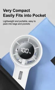 Portable handheld mini fan showing compact size fitting easily into a pocket