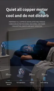 Quiet handheld USB fan with copper motor showing low noise levels in a bedroom
