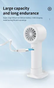 Portable white mini fan charging with USB cable on a stylish blue background