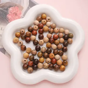 Close-up of assorted 10mm mixed natural wood beads for DIY jewelry making crafts