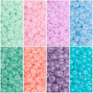 Detailed display of colorful 3x6mm glass beads in various shades for DIY jewelry making.