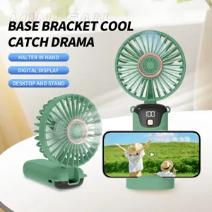 Close-up of portable USB mini fan with digital display and phone stand feature