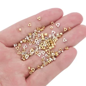 Detail shot of 14K gold-filled and silver geometric spacer beads for DIY jewelry