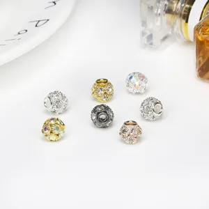 Detailed macro shot of sparkling rhinestone encrusted hollow spacer beads for DIY jewelry