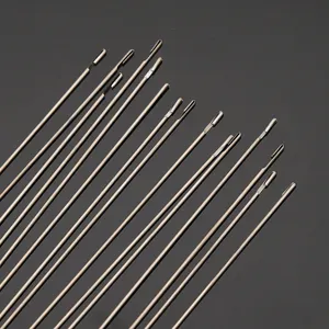 Macro detail of stainless steel beading needles showing the side-opening eye for jewelry DIY