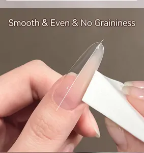 Close-up of sponge applying gradient nail gel for a smooth, even ombre finish