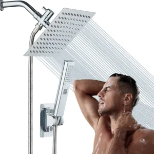 Detailed view of the large stainless steel rain shower head and handheld wand in use