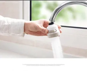 Macro view of adjustable kitchen faucet aerator showing pressurized water spray mode