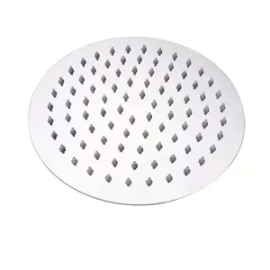 Detail view of a circular stainless steel rainfall shower head with silicone nozzles