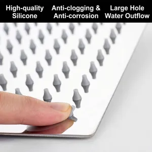 Stainless steel rain shower head with anti-clogging silicone nozzles close-up view