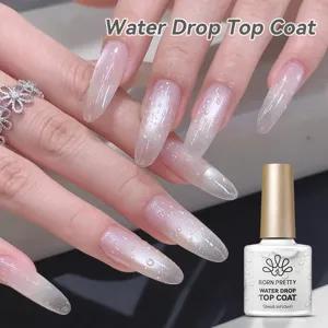 Κοντινό πλάνο του εφέ BORN PRETTY 3D water drop top coat σε ροζ ντεγκραντέ νύχια