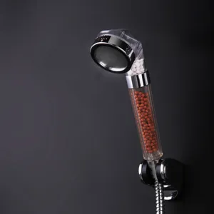 High-pressure ionic filtration shower head with mineral beads for water softening