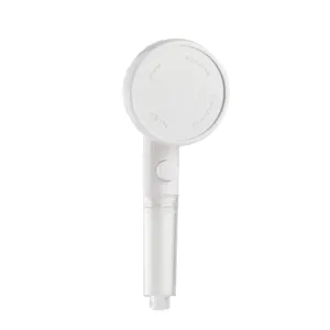 White handheld filtered pressurized shower head with stop switch and stainless steel face