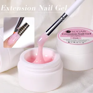 Detail of 15ml pink extension nail gel being applied with a brush for salon results.