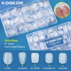 Close-up of frosted nail tips in various shapes: oval, almond, coffin, and square.