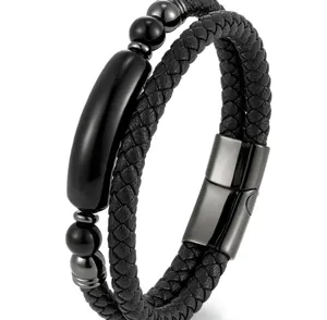 Close-up of men's braided leather bracelet with black beads and magnetic clasp