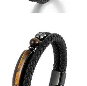 Macro detail of natural tiger eye stone and premium black braided leather on men's bracelet