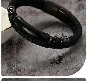 Close-up of black braided leather bracelet with glossy beads and magnetic clasp detail.