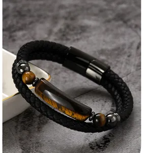 Detail of men's double-wrap braided leather bracelet with vintage tiger eye stone