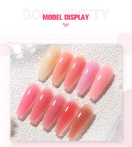 Detailed view of semi-transparent jelly pink and nude extension nail tips with glossy finish