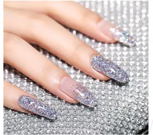 Close-up shot of sparkling silver glitter nail extensions with holographic shine effect