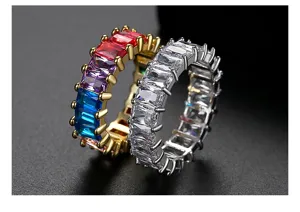 Detailed view of gold rainbow and silver clear baguette cut cubic zirconia eternity rings