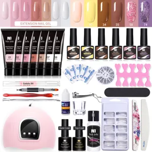 Kit completo de gel de extensión de uñas con lámpara UV, esmaltes de colores y herramientas.