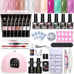 Kit completo de extensión de uñas con lámpara UV LED, esmaltes gel y herramientas.