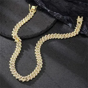 Detailed close-up of a gold-plated hip hop Cuban link necklace with sparkling rhinestones