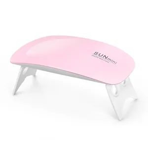 Mini lámpara de uñas UVLED SUNmini rosa compacta con soporte plegable