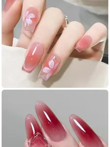 Close-up view of floral gradient and dark pink blush nail art designs with glossy finish