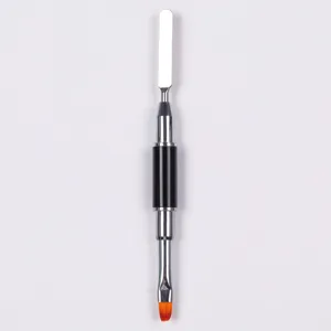 Close-up of a dual-ended nail art tool with a steel spatula and orange gel brush