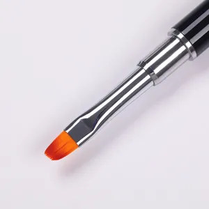 Close-up of professional UV gel nail brush with orange bristles for extensions