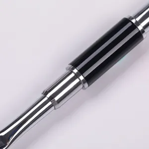 Close-up detail of the metal handle and black barrel of a dual-ended nail art tool.