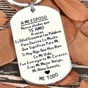 Detail of stainless steel keychain with engraved Spanish love message for husband gift